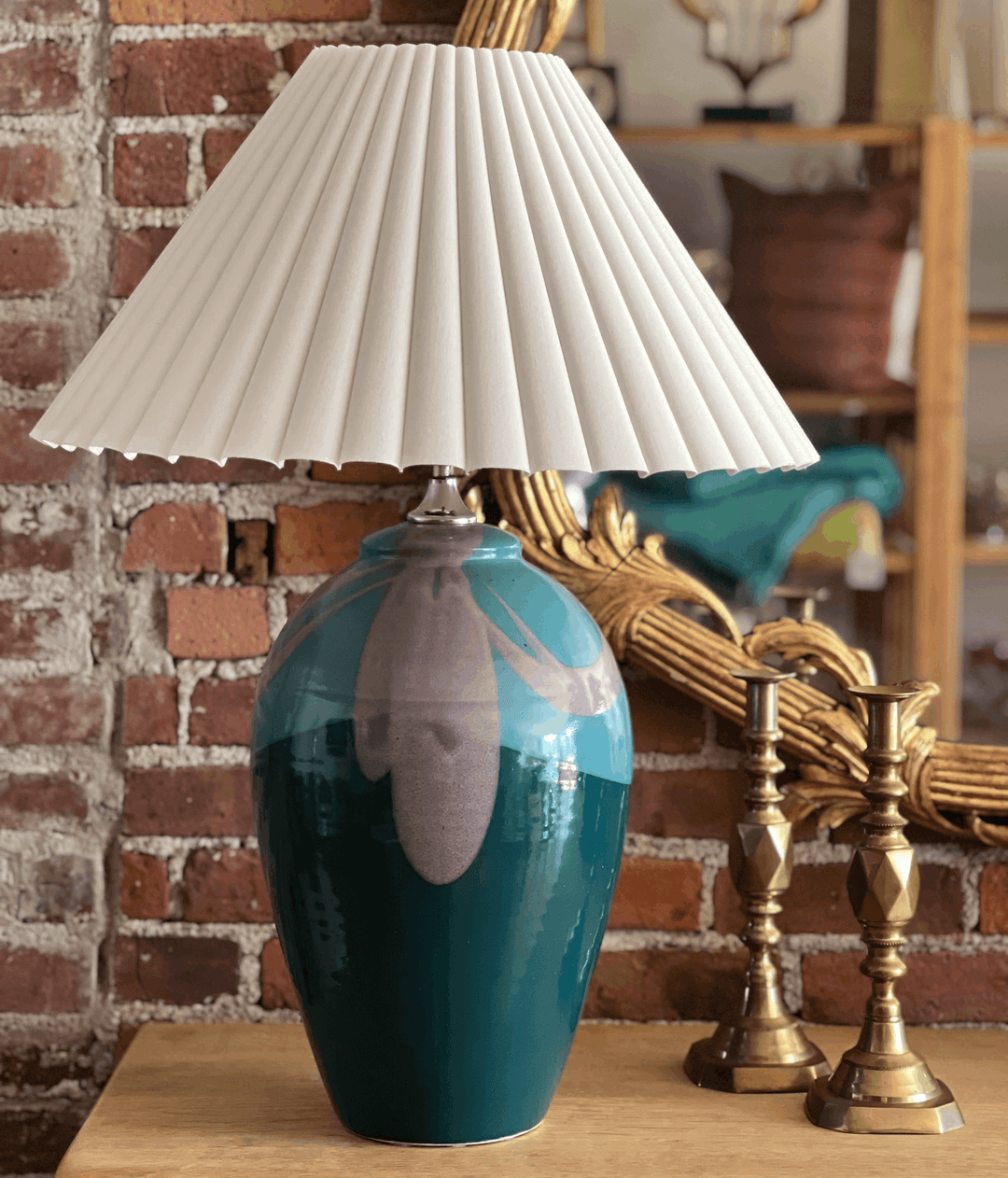 Collected Thoughts Featured Find - Pair of 1980s Pottery Lamps showcasing a teal ceramic base and a pleated white shade.