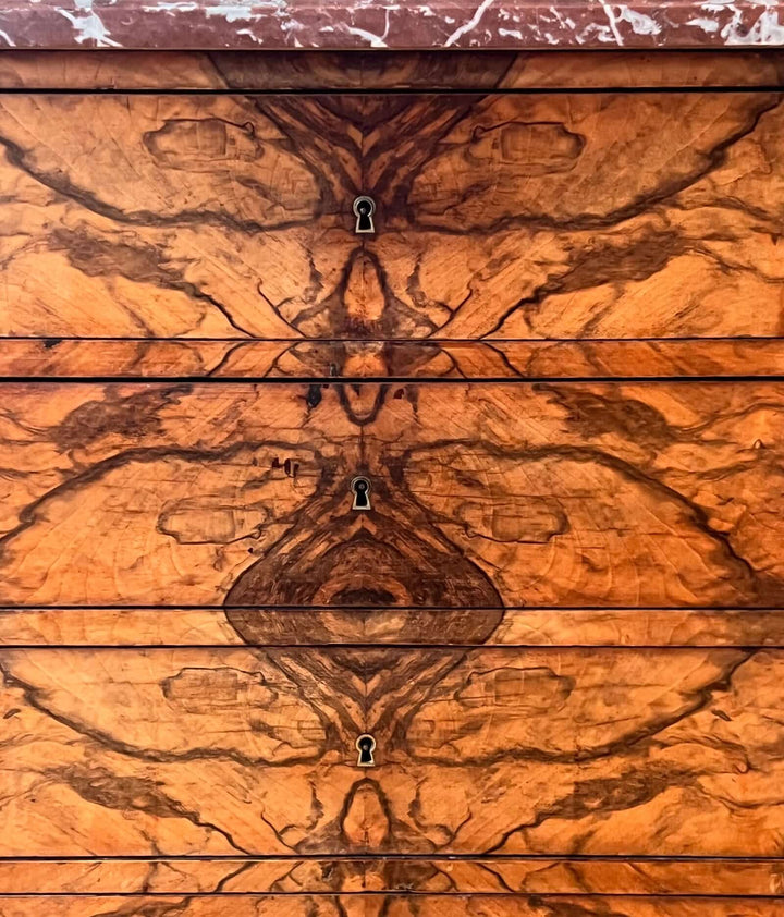19th-century French Louis-Philippe Marble-top Commode with intricate hand-veneered walnut drawer fronts.