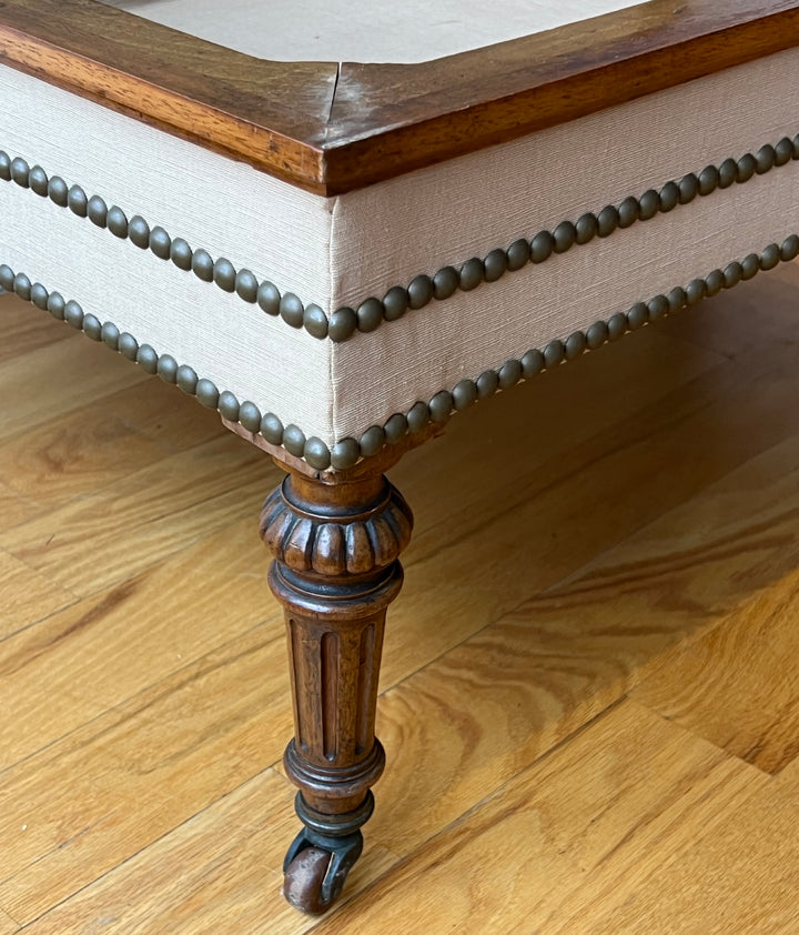 Antique English Tufted Storage Bench on Fluted Legs with Casters detailing the fluted leg and nailhead trim.