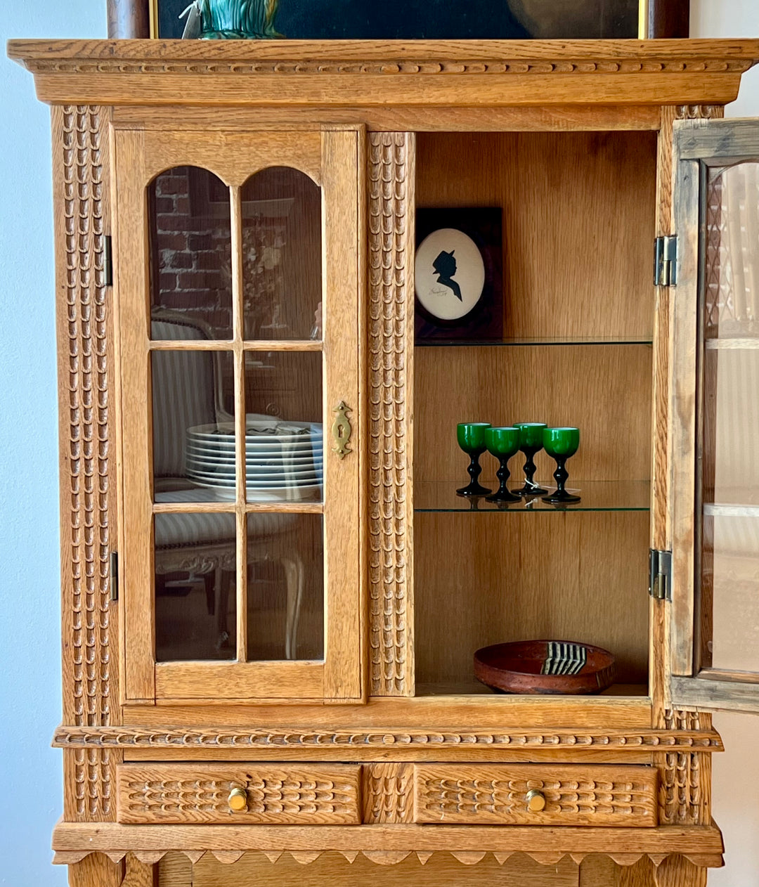 Antique Danish Oak Cabinet with Hidden Drawer and 1816 Lock circa 1930s showcasing handcrafted details and glass-paneled doors.