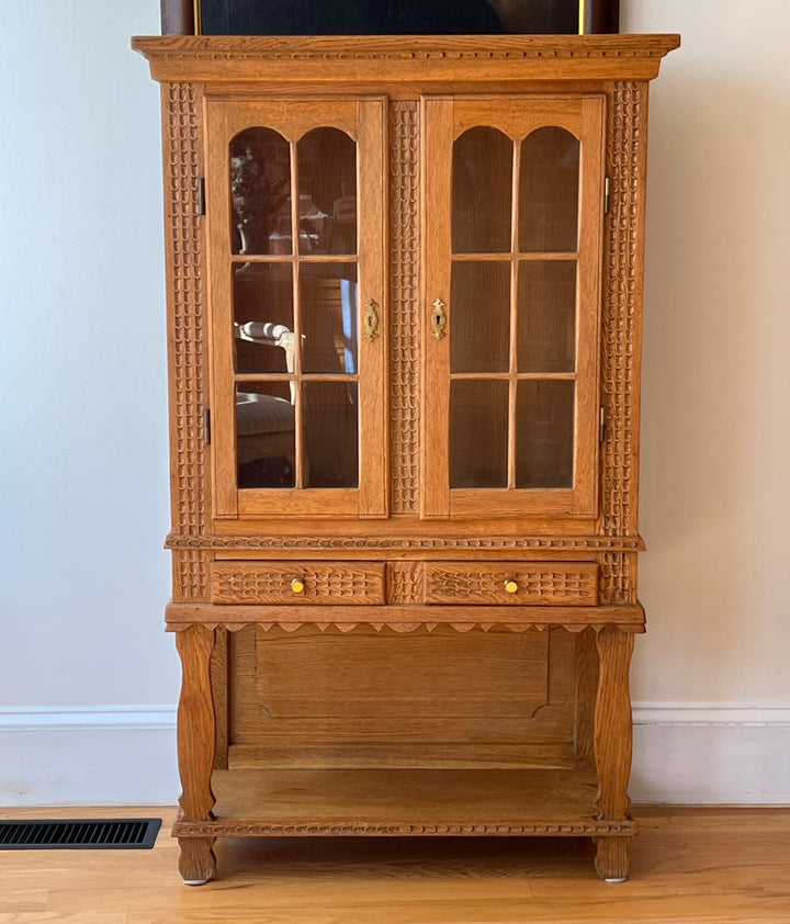 Antique Danish Oak Cabinet with Hidden Drawer and 1816 Lock circa 1930s displayed elegantly with glass-paneled doors.