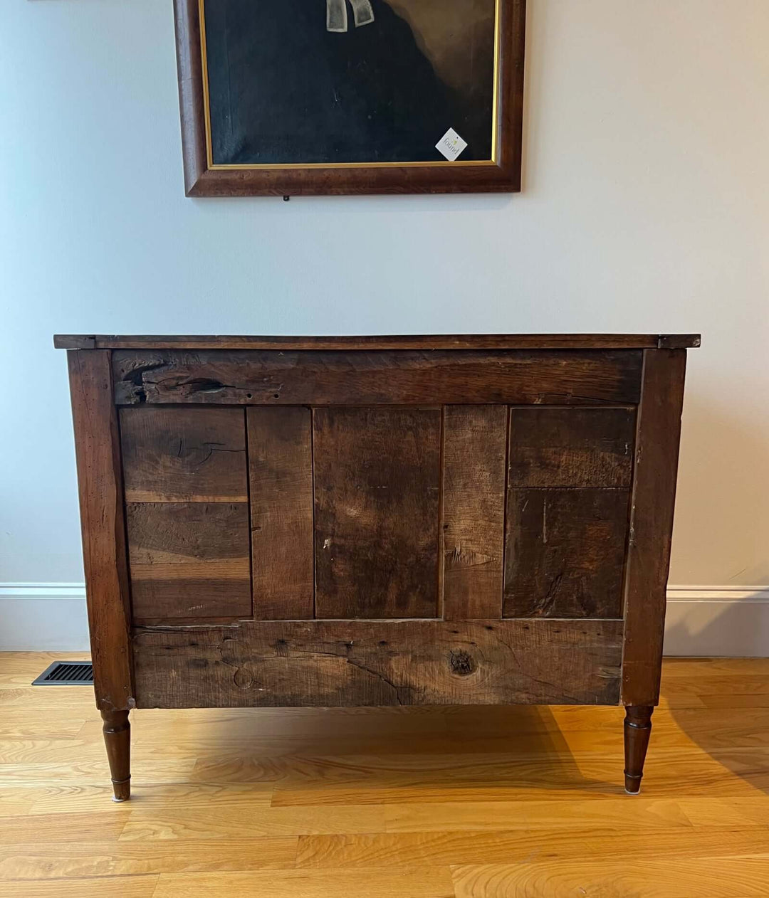 Early 19th Century French Louis XVI Style Walnut Three-Drawer Commode with rounded corners and fluted stiles.
