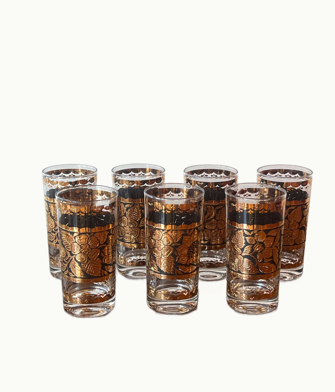 Set of Georges Briard Gold & Black Floral Highball Glasses arranged elegantly with 22-karat gold accents.