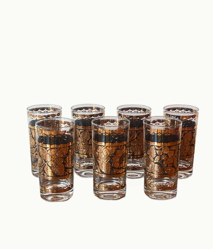 Set of Georges Briard Gold & Black Floral Highball Glasses arranged elegantly with 22-karat gold accents.