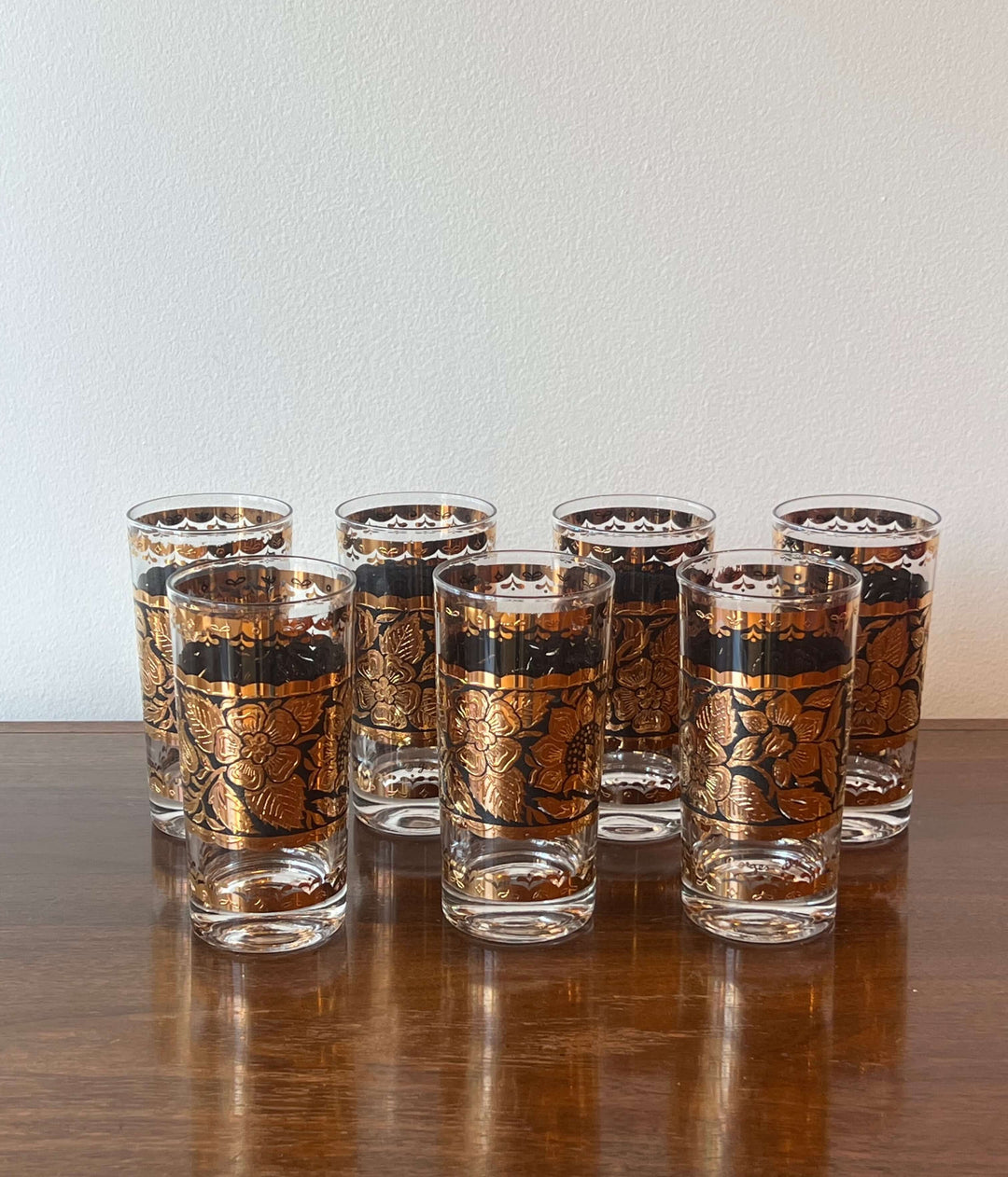 Set of Georges Briard Gold & Black Floral Highball Glasses, featuring bold black and gold floral motifs.