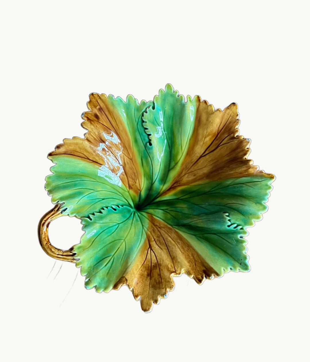 Vintage Portuguese Majolica Leaf Dish featuring vivid green and amber glaze with a vine handle.