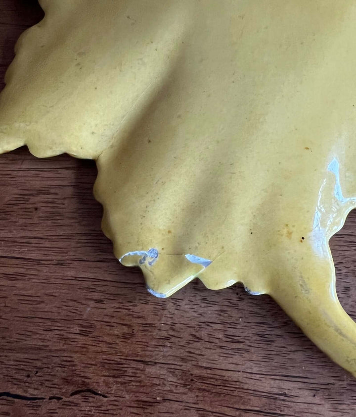 Close-up of Vintage Portuguese Majolica Leaf Dish showcasing its yellow glaze and naturalistic leaf shape.