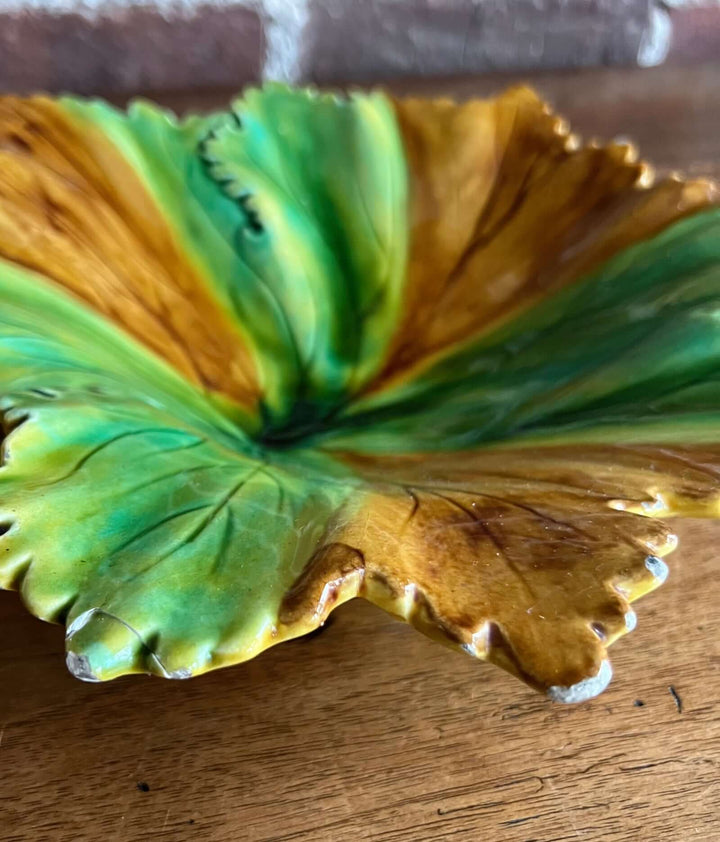 Vintage Portuguese Majolica Leaf Dish featuring a fig leaf design with green and amber glaze.