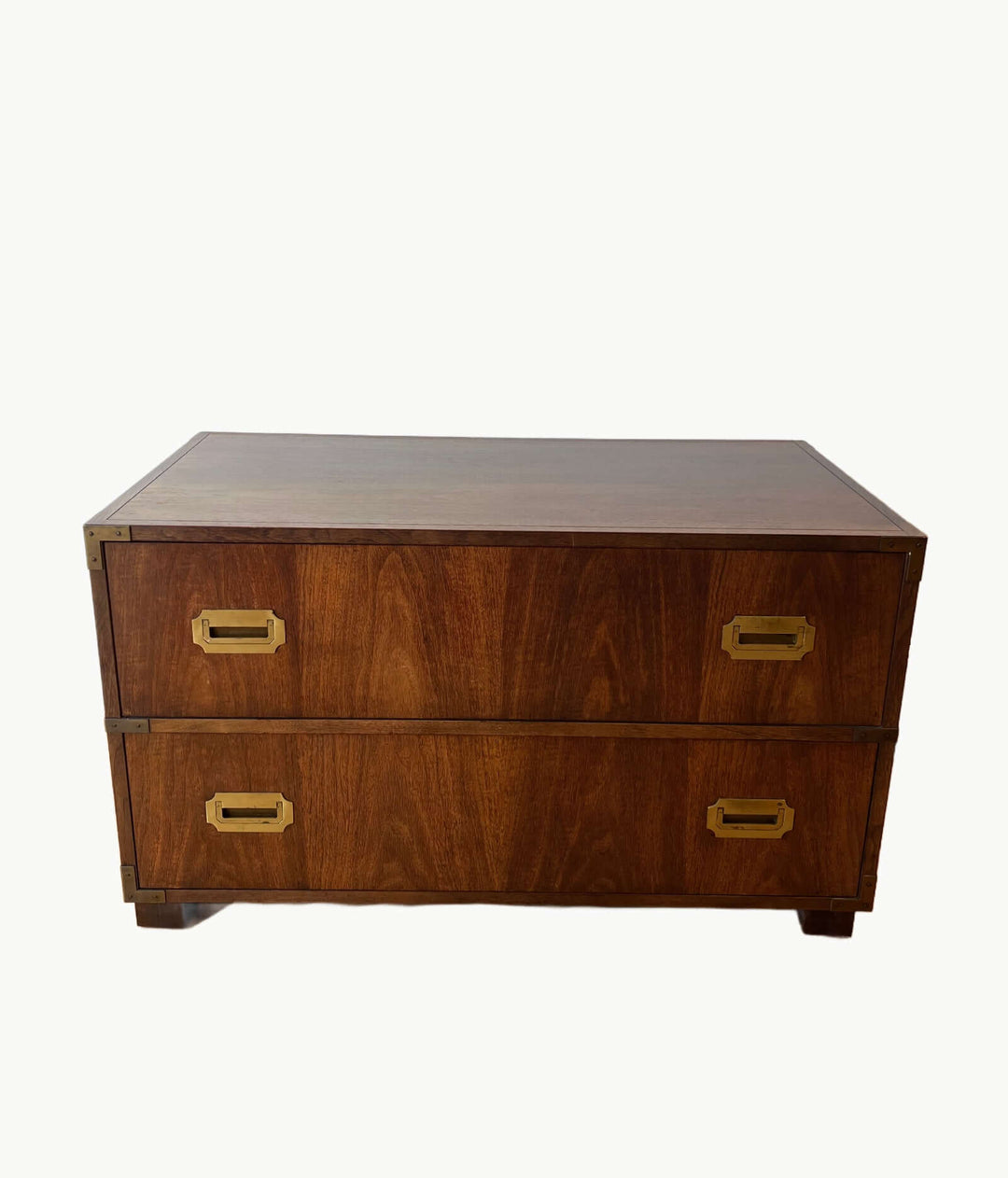 Wooden chest with two drawers and brass handles on a white background