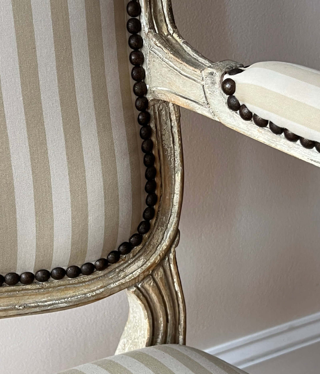 Close-up of the fabric and detailing of a Pair of Vintage Louis XV Style Fateuil armchairs.