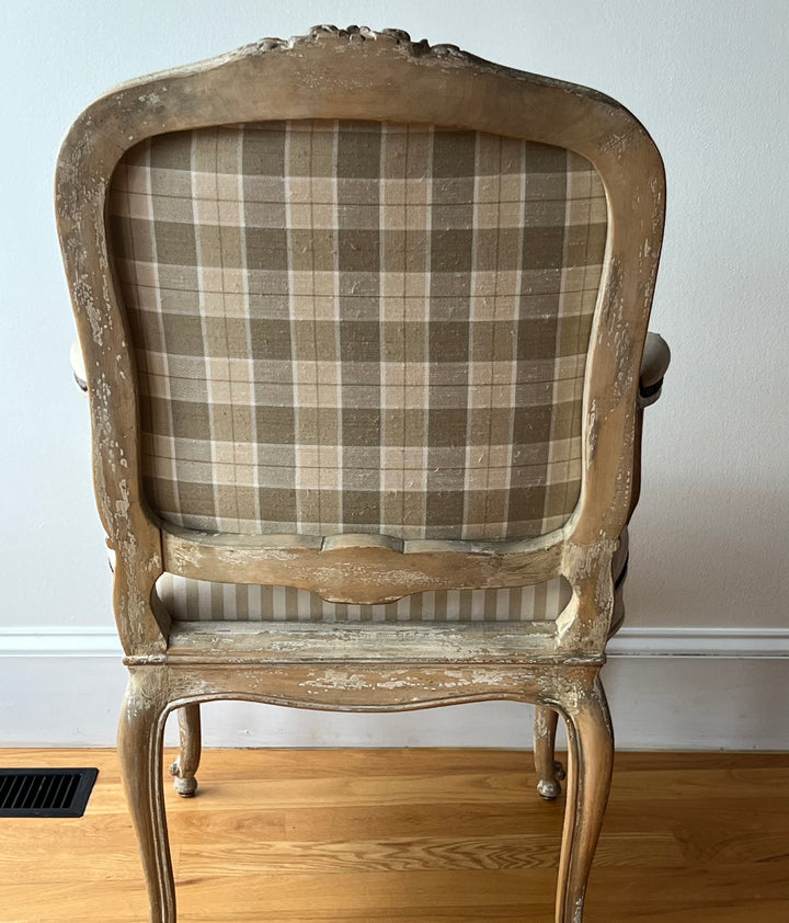 Pair of Vintage Louis XV Style Fateuil armchairs with plaid back and distressed wood frame.