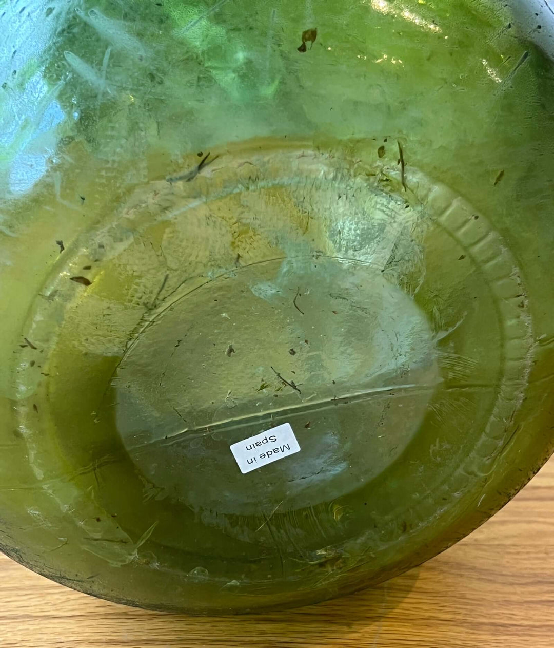 Vintage Spanish Green Demijohn Bottle with Rolled Rim base, showcasing bubbles and texture, handcrafted in mid-century Spain.