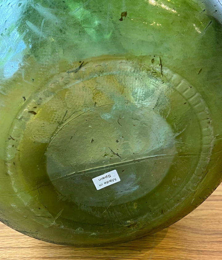 Vintage Spanish Green Demijohn Bottle with Rolled Rim base, showcasing bubbles and texture, handcrafted in mid-century Spain.
