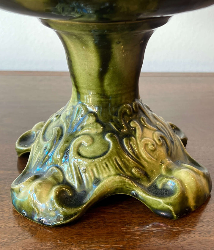 Antique European Majolica Compote with Ornate Relief and Green Glaze footed base showcasing intricate detailing.