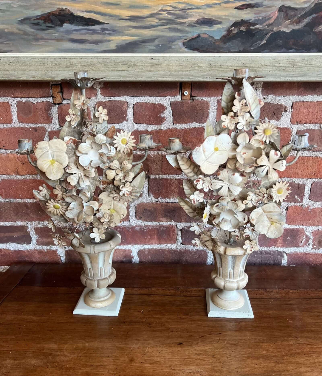 Pair of Vintage Italian Tole Floral Candelabras with hand-painted flowers and urn-shaped bases.