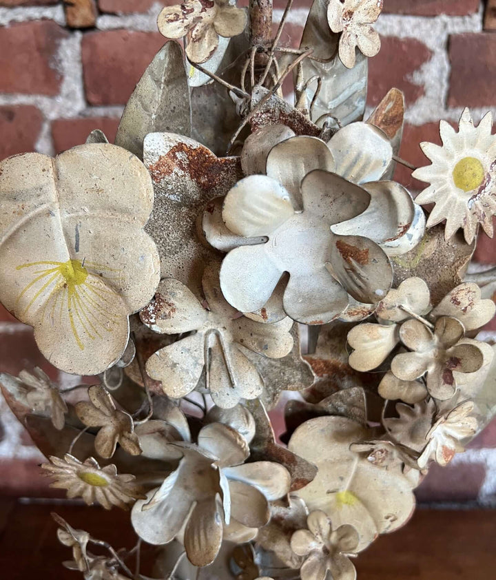Close-up of floral details on a Pair of Vintage Italian Tole Floral Candelabras, showcasing hand-painted metal flowers in soft tones.