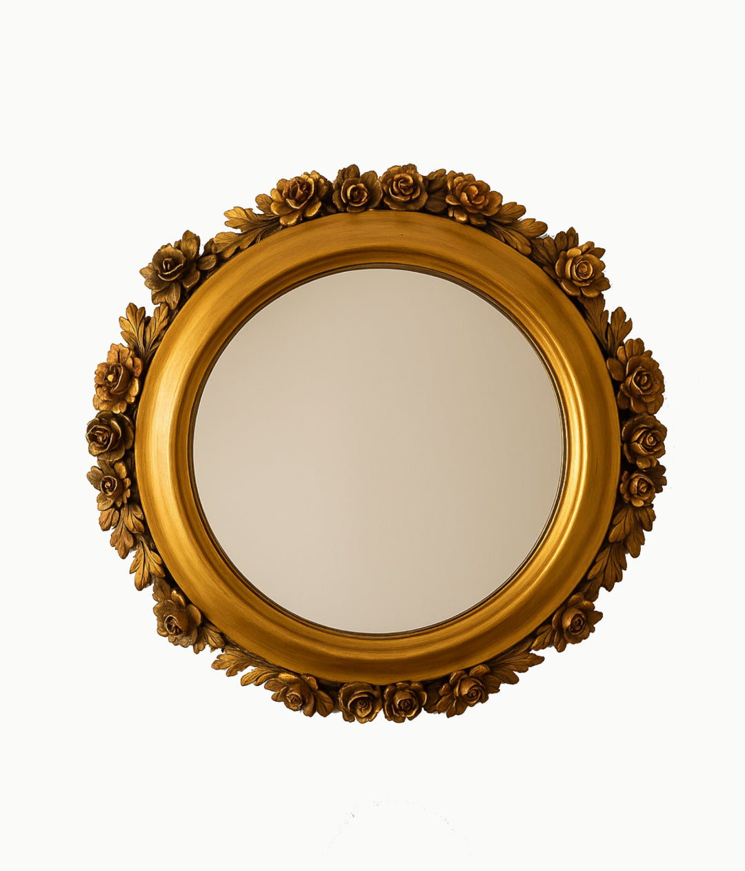Decorative gold mirror with floral patterns on a white background