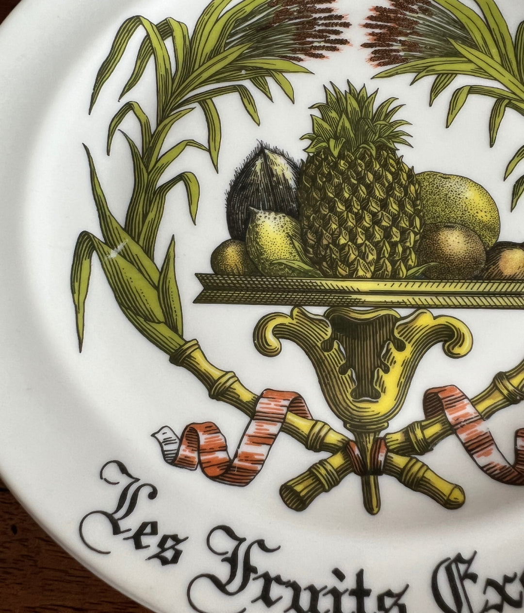 Detail of pineapple and tropical fruit design on 7.5 inch Limoges porcelain plate
